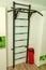 Sports equipment, ladder with a horizontal bar in the children`s room