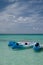 Sports equipment sits on the clear waters of the Cayman Islands