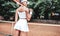 Sports Fashion. Beautiful Woman On Tennis Court