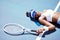 Sports fatigue and tired tennis girl on ground in sun with athlete burnout at tournament practice. Athletic black woman