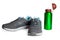 Sports footwear, thermos for water.