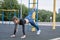 Sports girl doing exercises on the buttocks on the playground.