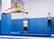 Sports girl training side split on trampoline