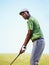 Sports, golf and black man focus for stroke in game, match and competition on golfing course. Recreation, hobby and male
