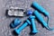 Sports and health idea. Dumbbells, cyan skipping rope, water bottle