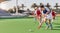 Sports, hockey and women in action on field playing game, match and training in outdoor stadium. Fitness, exercise and