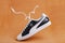sports leather Puma sneakers with laces. Black and white color, soft sole