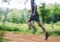 Sports man, speed and running in forest with motion blur, cardio workout and exercise action. Runner, fast athlete and