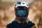 Sports, motorcross and portrait of man with helmet for dirt racing, mountain biking and training. Adventure, cycling and