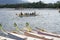 Sports Native Row Boats Parked at Lakeshore during Dragon Cup Competition.