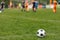 Sports outdoor background. Soccer ball on the field