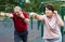 Sports pensioners are engaged in martial art on the sports ground in open air