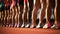 Sports photo from the sidelines of the starting line of an Olympic track race, beautiful athletic women are lined up in the