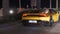 Sports premium yellow car on a night street in Dubai