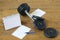 Sports records on a wooden background, next to the fitness equipment