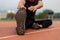 Sports and recreation concept a male youth doing warm-up by stretching each part of his body as preparation before exercise