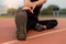 Sports and recreation concept a male youth doing warm-up by stretching each part of his body as preparation before exercise