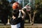 Sports and recreation concept a young male teenager practicing shooting a basketball separately in the court after school