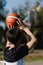 Sports and recreation concept a young male teenager practicing shooting a basketball separately in the court after school