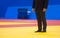 Sports referee on a yellow wrestling carpet in the gym