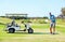 Sports, relax and swing with man on golf course with cart for hobby, training and competition. Game, action and fitness