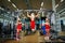 Sports Santa Claus with girls in Santa`s costumes in the gym.