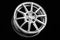 Sports silver cast disc on a black background. wheels and auto parts