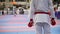Sports teenagers - kid sportsmen at karate tatami - ready for fight