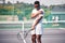 Sports, tennis and arm pain on court after training, game or match outdoors. Healthcare, tennis player and injured black