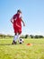 Sports, training and girl playing soccer for fitness, physical activity and hobby on a field in Spain. Active, focus and