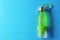 Sports water bottle on color background