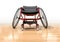 Sports Wheelchair On Polished Wooden Floor