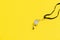 Sports whistle on yellow background. Concept - sport competition, referee, statistics, challenge. Basketball, handball, futsal, vo