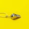 Sports whistle on yellow background. Concept- sport competition, referee, statistics, challenge. Basketball, handball, futsal, vol