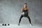 Sports Woman In Fashion Sportswear Squats With Fitness Ball