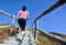 Sports woman running on mountain stairs