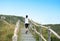 Sports woman running on mountain stairs