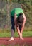 Sports woman stretching legs muscles and bend back before  run