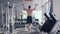Sports workout, strong bodybuilder man with athletic body pulls up on bar during strength training at gym