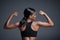 Sports, workout and woman flexing back in studio isolated on a black background. Strong flex, muscle and female athlete