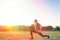 Sports and yoga. A man with a beard, in sportswear squats during a workout. Light and copy space