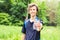 Sportsman with a bottle of water after running outdoors in park