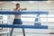 Sportsman boxer at training in boxing ring