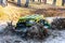 Sportsman on buggy drives splashing in water at Mud Racing contest. ATV SSV motobike