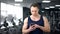 Sportsman checking fitness application in smartphone, personal program online