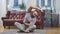 Sportsman doing bends to the side relaxing in lotus position at living room