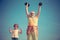 Sportsman grandfather and healthy kid with dumbbell exercise. Healthcare cheerful lifestyle. Sport and training concepts