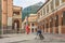 Sportsman mountain biker rides bike on Gorky Gorod hotel buildings background during downhill race competitions. Sochi, Russia