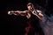 Sportsman muay thai boxer fighting on black background with smoke.