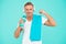 Sportsman promote healthy lifestyle. Happy sportsman on blue background. Fit sportsman with towel. Handsome sportsman